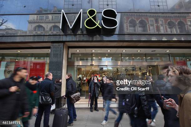 Members of the public walk past a branch of Marks & Spencer on January 7, 2014 in London, England. The food and clothing retailer, which has traded...