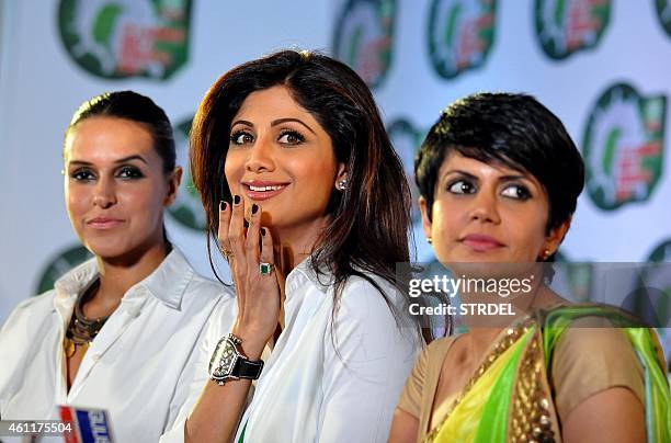 Indian Bollywood actresses Neha Dhupia , Shilpa Shetty and Mandira Bedi look on during a promotional event in Mumbai on January 8, 2015. AFP PHOTO /...