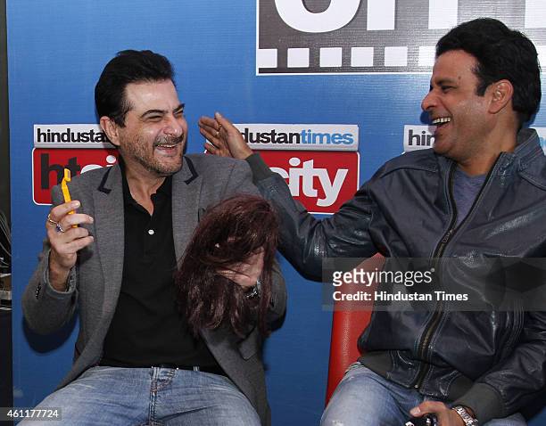 Bollywood producer Sanjay Kapoor with actor Manoj Bajpai during an exclusive interview for their upcoming movie Tevar at HT Media Office on January...