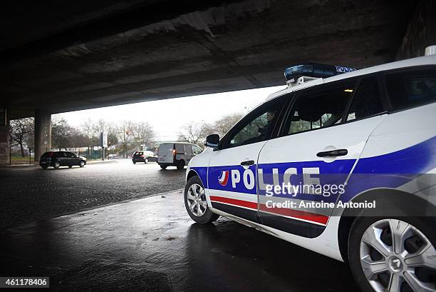 Police officers patrol under a bridge at Porte de la Villette after yesterday's terrorist attacks on January 8, 2015 in Paris, France. The country is...