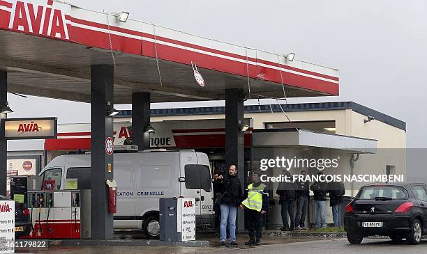Gendarmerie criminal identification van is parked in front of an Avia gas station in Villers-Cotterets, north-east of Paris, as gendarmes investigate...