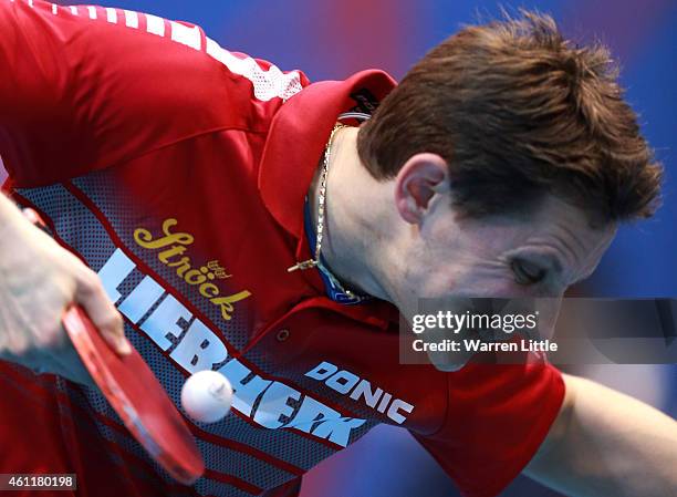 Robert Gardos of Austria in action against Jike Zhang of China during day one of the ITTF World Team Cup at the Al Nasr Sports Club on January 8,...