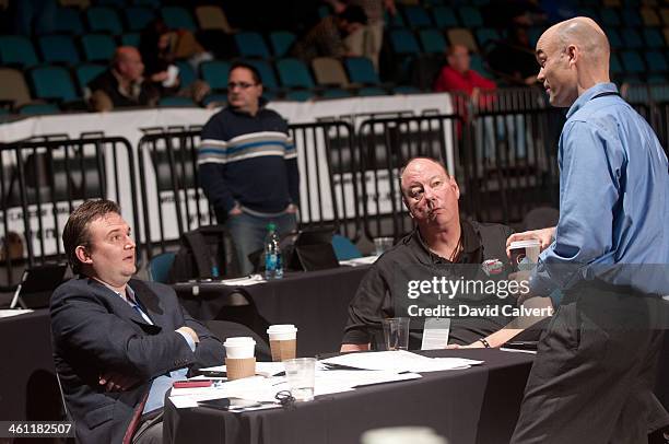 From left, Houston Rockets general manager Daryl Morey talks with Rio Grande Valley Vipers associate head coach Paul Mokeski and Memphis Grizzlies...