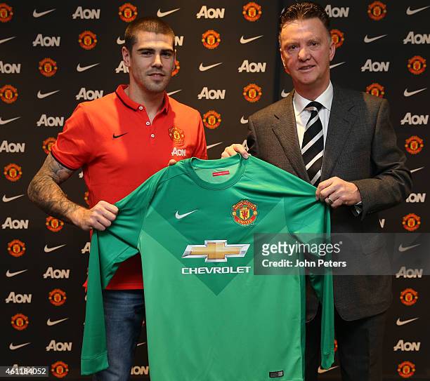 Victor Valdes of Manchester United poses with Manager Louis van Gaal after signing for the club at Aon Training Complex on January 8, 2015 in...
