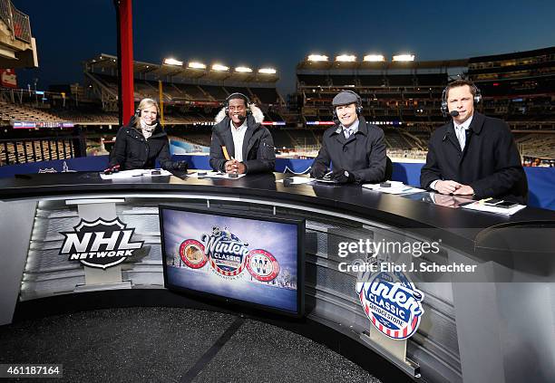 Network host Kathryn Tappen and analysts Kevin Weekes, Mike Rupp and Martin Biron look on after the 2015 Bridgestone NHL Winter Classic at Nationals...