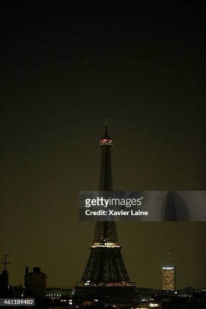 The Eiffel Tower goes dark at 8 pm in solidarity with victims of yesterday's terrorist attack on January 8, 2015 in Paris, France. Twelve people were...