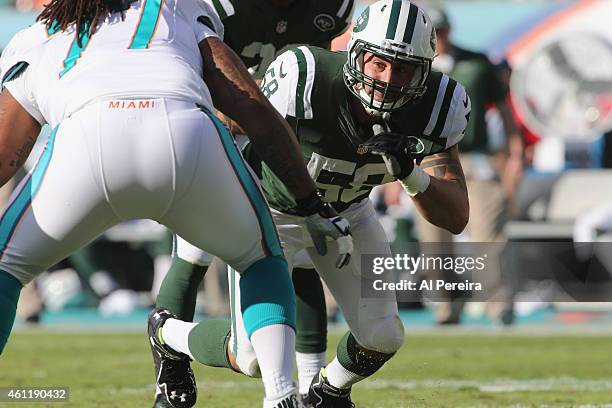 Linebacker Jason Babin of the New York Jets rushes against the Miami Dolphins at Sun Life Stadium on December 28, 2014 in Miami Gardens, Florida.