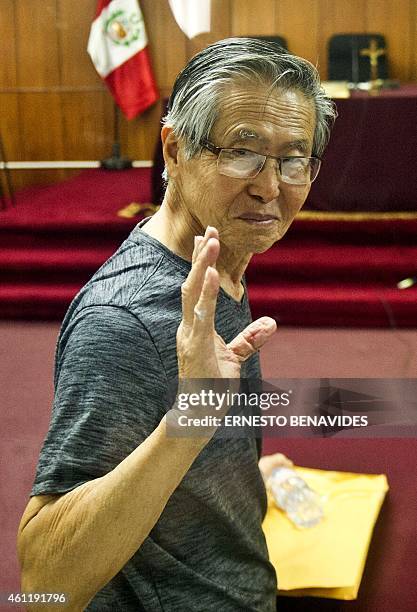 Peru's former President Alberto Fujimori, gestures just before the reading of the verdict on charges of embezzling state funds and using them to...