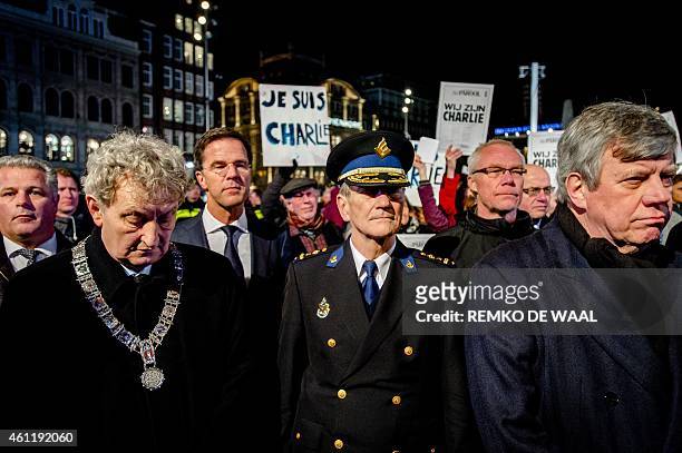 Dutch Minister Mark Rutte , Mayor of Amsterdam Eberhard van der Laan and Minister of Safety and Justice Ivo Opstelten attend an event paying respect...