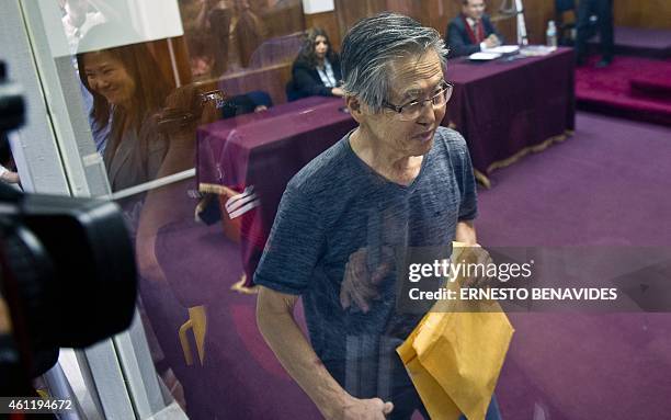 Peru's former President Alberto Fujimori, arrives for the reading of the verdict on charges of embezzling state funds and using them to manipulate...