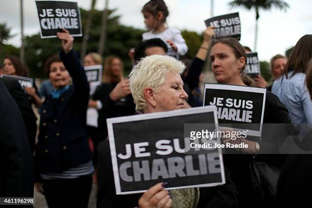 People hold signs reading 'Je Suis Charlie' , to show their support for the victims of the terrorist attack at French magazine Charlie Hebdo on...