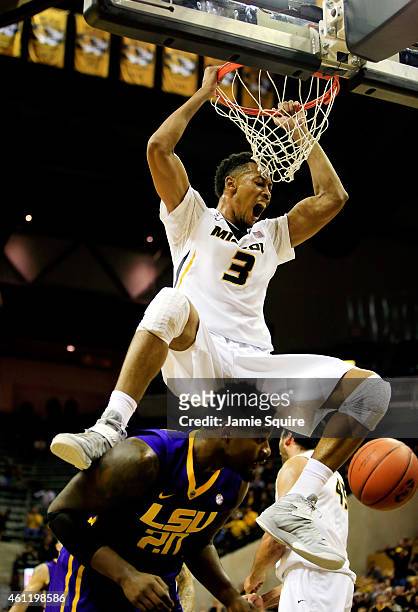 Johnathan Williams III of the Missouri Tigers dunks over Brian Bridgewater of the LSU Tigers during the game at Mizzou Arena on January 8, 2015 in...