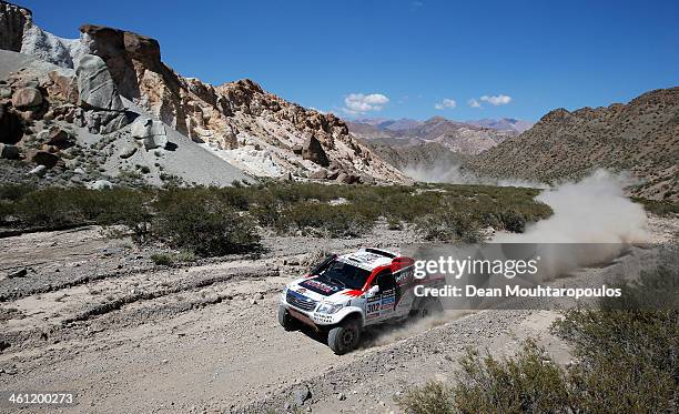 Giniel De Villiers of South Africa and Dirk Von Zitzewitz of Germany for Imperial Toyota compete on Day 3 of the Dakar Rally 2014 on January 7, 2014...