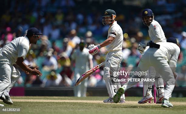 Australia's batsman David Warner is caught behind by India's Murali Vijay during day four of the fourth cricket Test between Australia and India at...