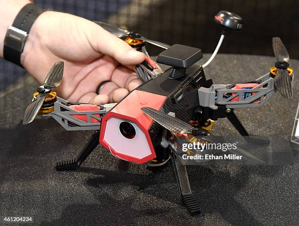 An attendee looks at an RC EYE Navigator 250 drone from RC Logger at the 2015 International CES at the Las Vegas Convention Center on January 8, 2015...