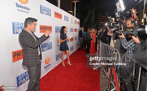 Actor Esai Morales takes a picture of the press line at the premiere of Pantelion Films' "Spare Parts" at ArcLight Cinemas on January 8, 2015 in...