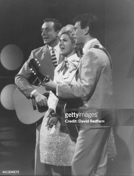 English pop folk group The Springfields, featuring from left, Mike Hurst, Dusty Springfield and Tom Springfield, perform together on a television...