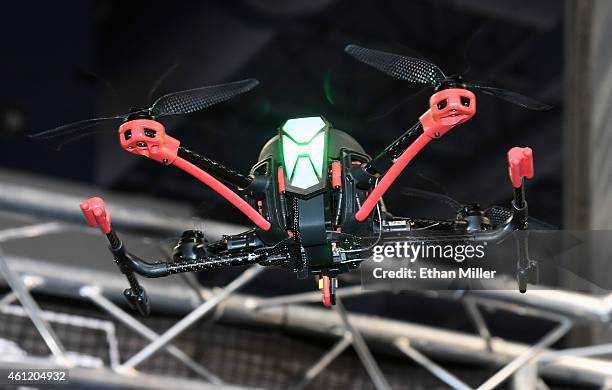 An RC NovaX 350 drone from RC Logger flies at the 2015 International CES at the Las Vegas Convention Center on January 8, 2015 in Las Vegas, Nevada....