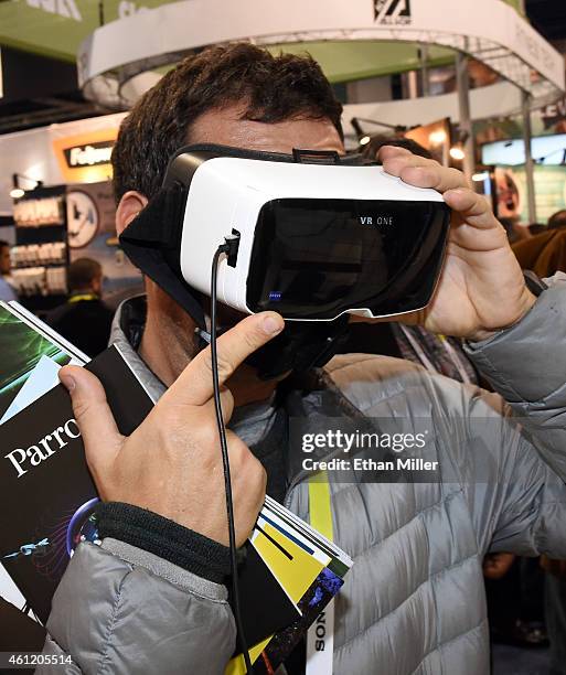 Juan Cobian Fernandez of Spain tries the VR One as part of the Parrot Bebop Drone Skycontroller at the 2015 International CES at the Las Vegas...