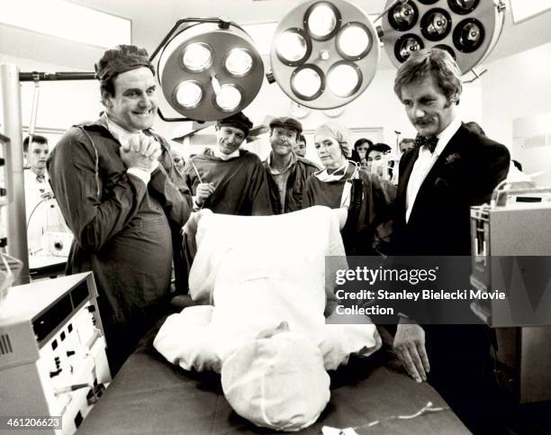 Actors Michael Palin, John Cleese, Graham Chapman and Eric Idle; in a hospital scene from the film 'Monty Python's The Meaning of Life', 1983.