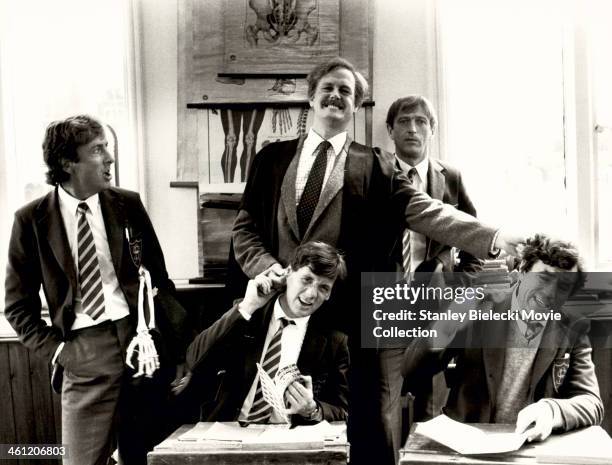 Actors Michael Palin, John Cleese, Graham Chapman, Terry Jones and Eric Idle; in a schoolroom scene from the film 'Monty Python's The Meaning of...