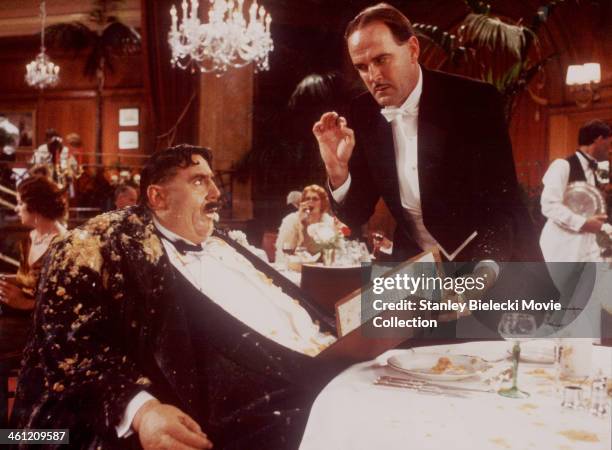 Actors John Cleese and Terry Jones in the 'Mr. Creosote' sketch, from the film 'Monty Python's The Meaning of Life', 1983.
