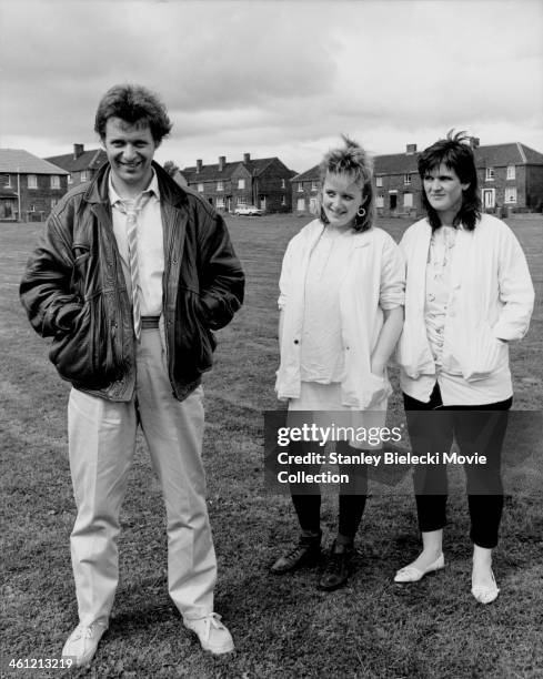 Promotional shot of actors George Costigan, Michelle Holmes and Siobhan Finneran, as they appear in the film 'Rita, Sue and Bob Too!', 1987.