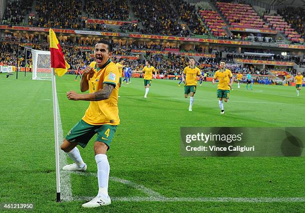 Tim Cahill of Australia celebrates scoring his first goal in the first half during the 2015 Asian Cup match between the Australian Socceroos and...