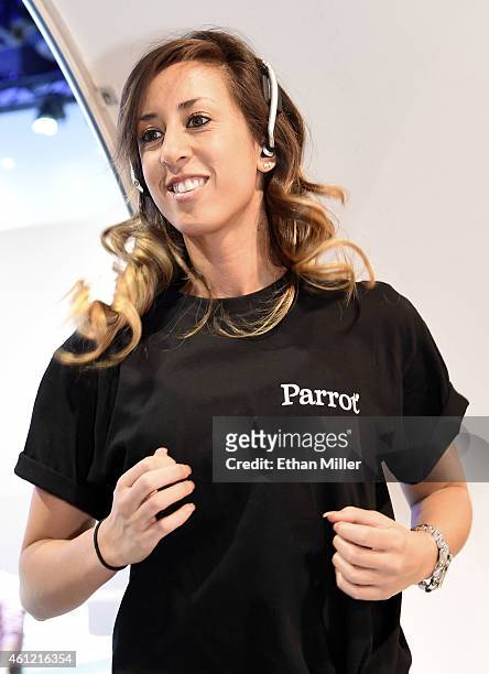 Nikki Obra runs on a treadmill while wearing Parrot Zik Sport wireless in-ear sport headphones at the 2015 International CES at the Las Vegas...