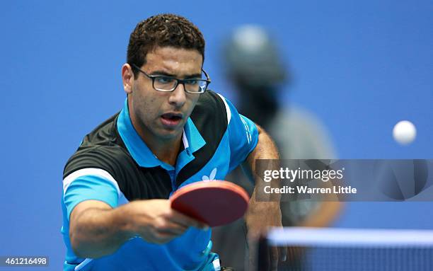 Omar Assar of Egypt in action against Stefan Fegerl of Austria during day two of the 2015 ITTF World Team Cup at Al Nasr Sports Club on January 9,...