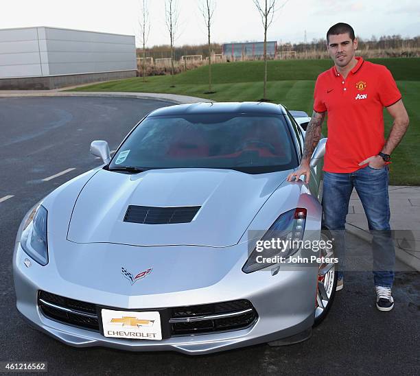 Victor Valdes of Manchester United poses with his Chevrolet after signing for the club at Aon Training Complex on January 8, 2015 in Manchester,...