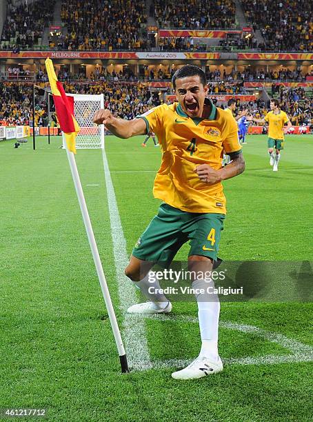 Tim Cahill of Australia celebrates scoring his first goal in the first half during the 2015 Asian Cup match between the Australian Socceroos and...