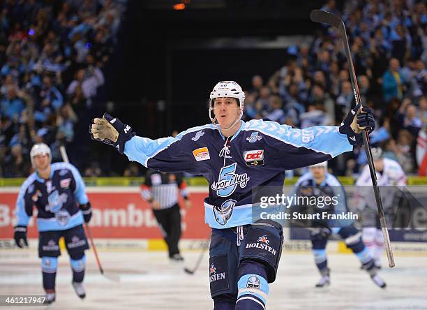 Jerome Flaake of Hamburg celebrates scoring his goal during the DEL ice hockey match between Hamburg Freezers and Eisbaeren Berlin at O2 World on...