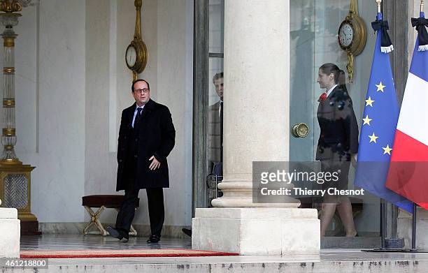 French President Francois Hollande leaves the presidential Elysee palace to hold a crisis meeting with French prefects at the Interior Ministry on...