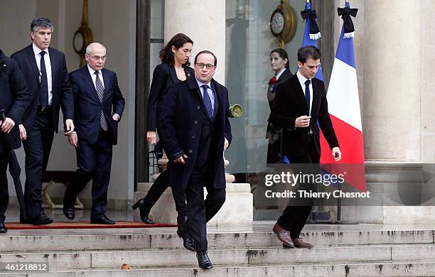 French President Francois Hollande leaves the presidential Elysee palace to hold a crisis meeting with French prefects at the Interior Ministry on...