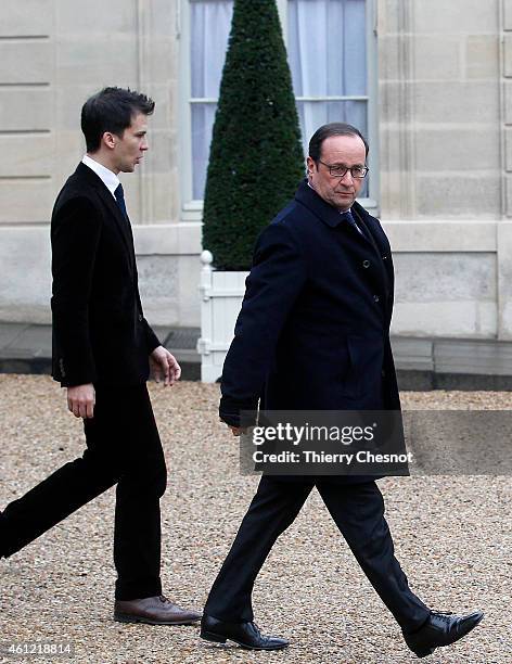 French President Francois Hollande leaves the presidential Elysee palace to hold a crisis meeting with French prefects at the Interior Ministry on...