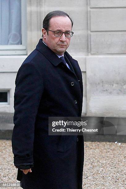 French President Francois Hollande leaves the presidential Elysee palace to hold a crisis meeting with French prefects at the Interior Ministry on...