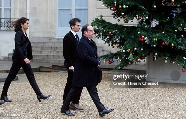 French President Francois Hollande leaves the presidential Elysee palace to hold a crisis meeting with French prefects at the Interior Ministry on...