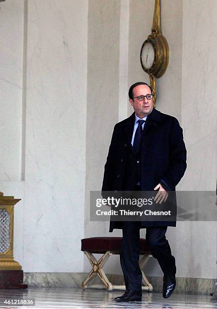 French President Francois Hollande leaves the presidential Elysee palace to hold a crisis meeting with French prefects at the Interior Ministry on...