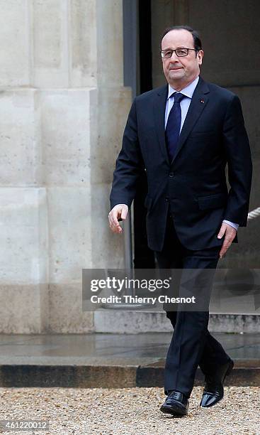 French President Francois Hollande returns to the presidential Elysee palace after holding a crisis meeting with French prefects at the Interior...