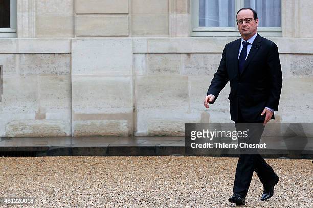 French President Francois Hollande returns to the presidential Elysee palace after holding a crisis meeting with French prefects at the Interior...