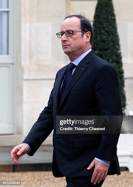 French President Francois Hollande returns to the presidential Elysee palace after holding a crisis meeting with French prefects at the Interior...