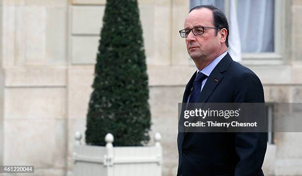 French President Francois Hollande returns to the presidential Elysee palace after holding a crisis meeting with French prefects at the Interior...