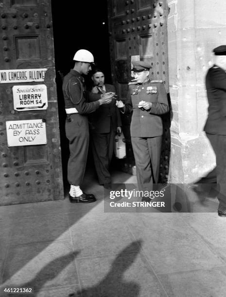 Soldier checks a visitor at the entrance of the Palace of Justice in Nuremberg where the International Military Tribunal tried Nazi leaders in 1946....