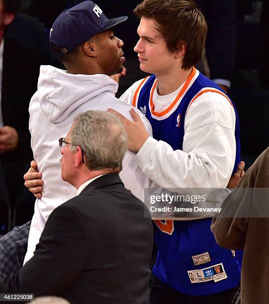 Victor Cruz and Ansel Elgort attend the Houston Rockets vs New York Knicks game at Madison Square Garden on January 8, 2015 in New York City.