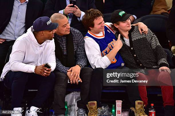 Victor Cruz, guest, Ansel Elgort and guest attend the Houston Rockets vs New York Knicks game at Madison Square Garden on January 8, 2015 in New York...