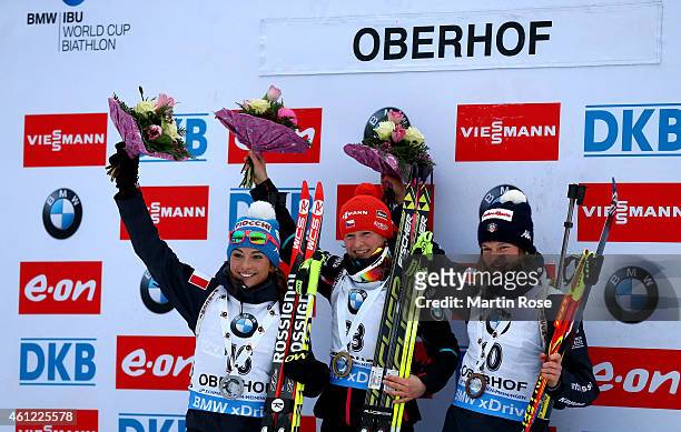 Veronika Vitkova of Czech Republic poses on the podium with second placed Dorothea Wierer of Italy and third placed Nicole Gontier of Italy after the...