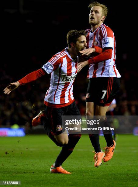 Fabio Borini of Sunderland celebrates with Sebastian Larsson as he scores their second goal from the penalty spot during the Capital One Cup...