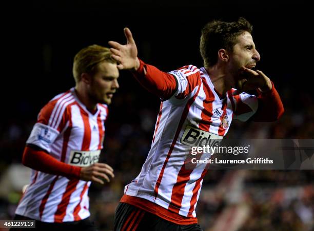 Fabio Borini of Sunderland celebrates with Sebastian Larsson as he scores their second goal from the penalty spot during the Capital One Cup...