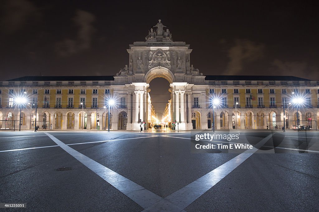 Archway at night in main square, Lisbon, Portugal